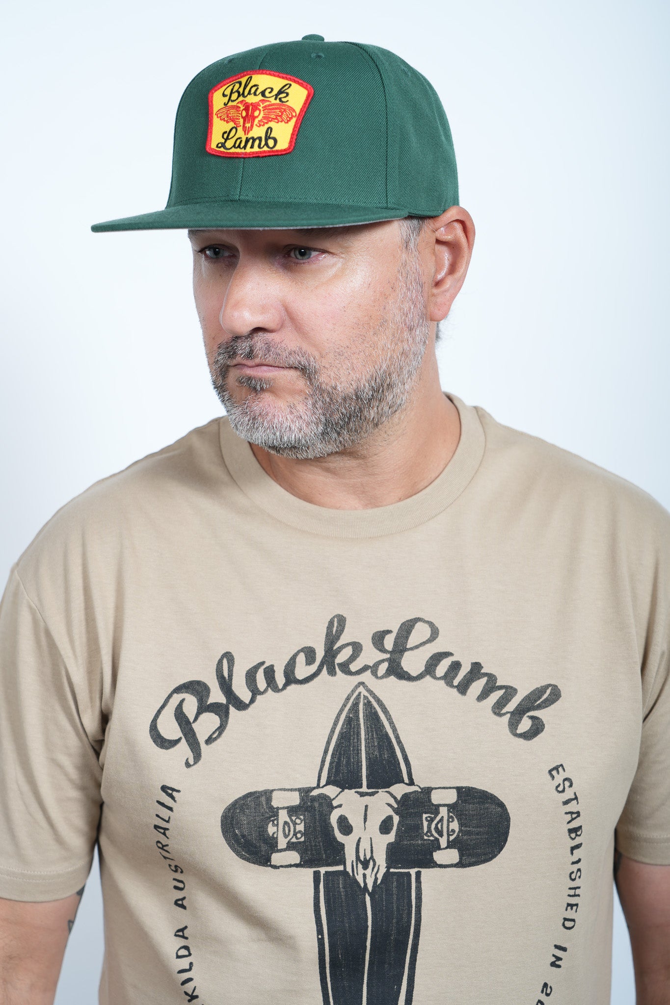 Green Hat with Red Yellow and Black Patch
